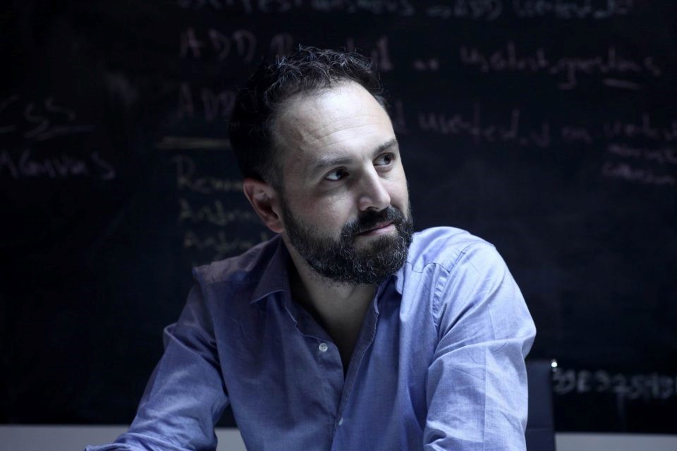 Kostis Karpozilos sitting and looking slightly to the left