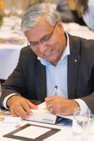photo of Nyunggai Warren Mundine AO at a table