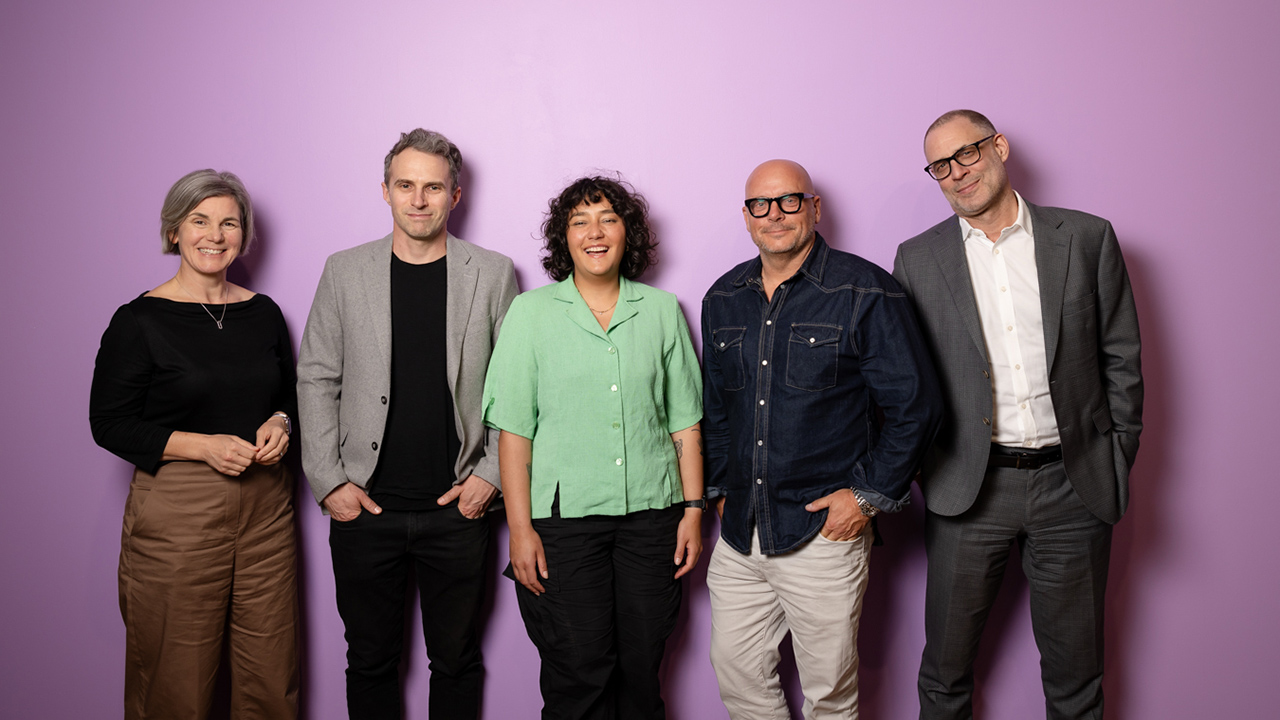 speakers from the Creative Conversation event standing in front of a pink wall