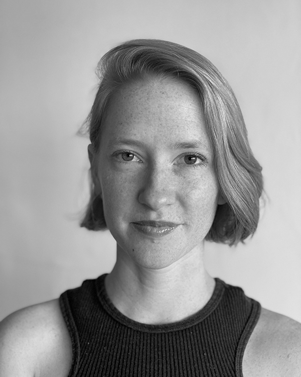A black and white portrait of Zoe Theodore.