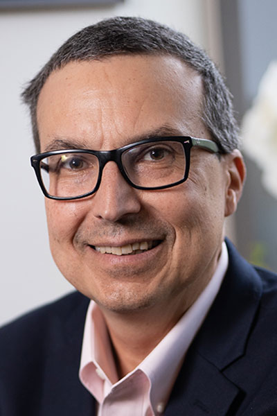 Picture of man with glasses, smiling