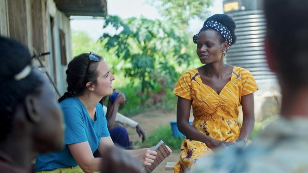 UNSW student talking to a women in Africa