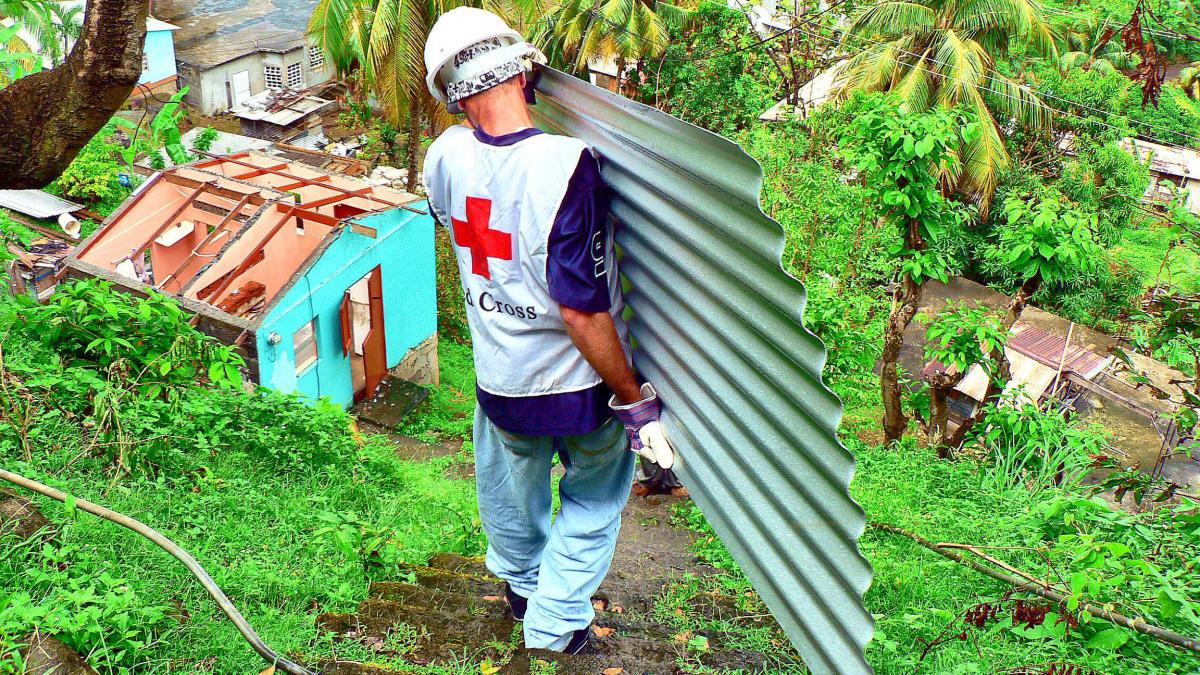 photo of red cross worked carrying roofing