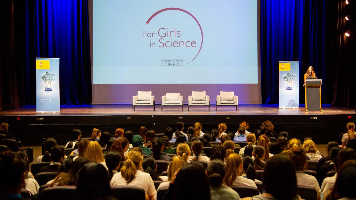 Photo of a past Girls in Science Forum with staeg and audience