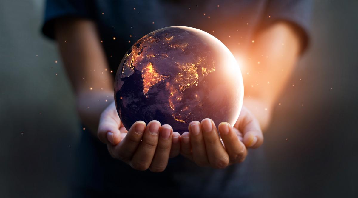 photo fo glowing globe in hands