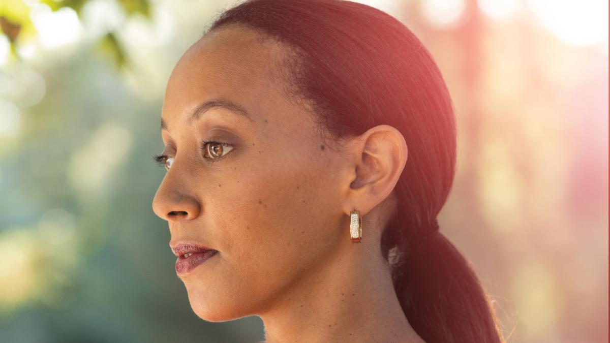 Profile photo of Haben Girma, taken from the shoulder upward, her hair pulled back in a neat ponytail and she's wearing small gold rectangular earrings