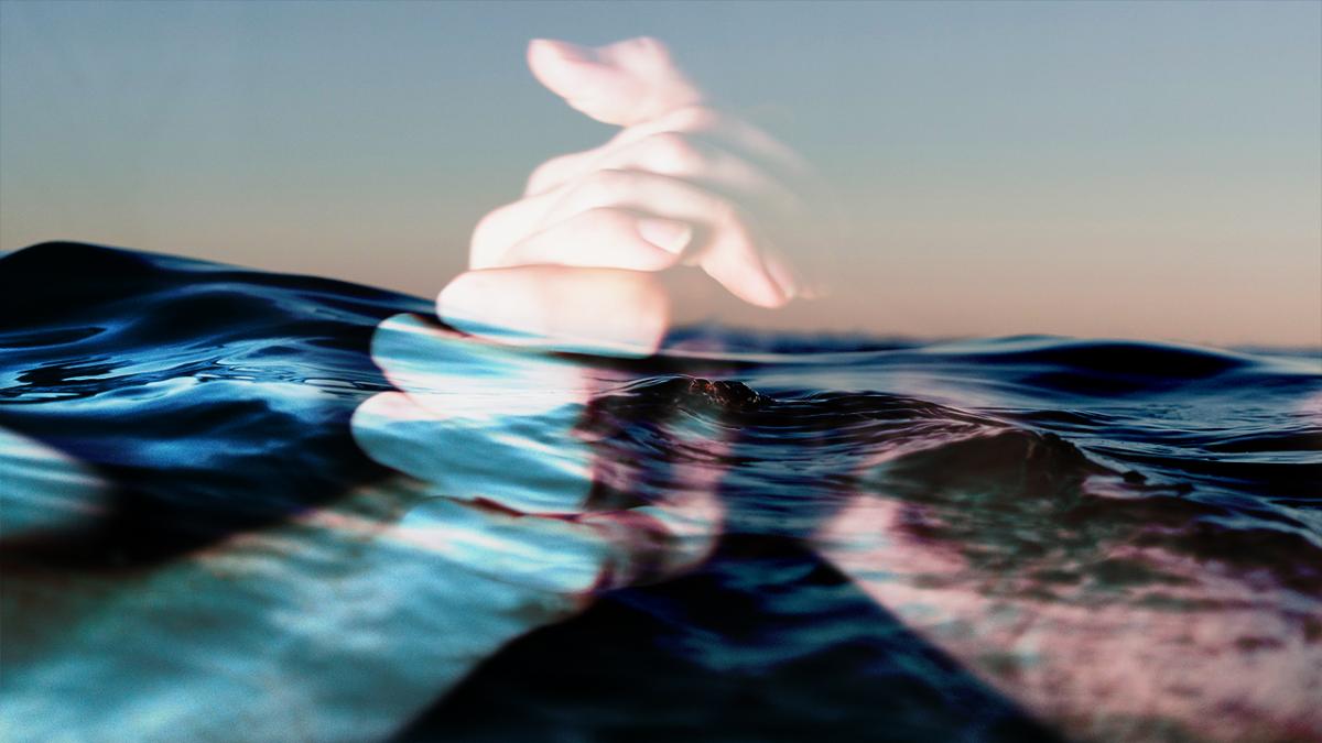 hands clasped over water photo montage