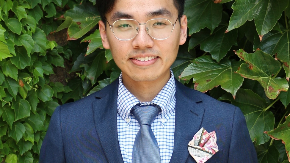 headshot of man in a suit - speaker Plato Tse
