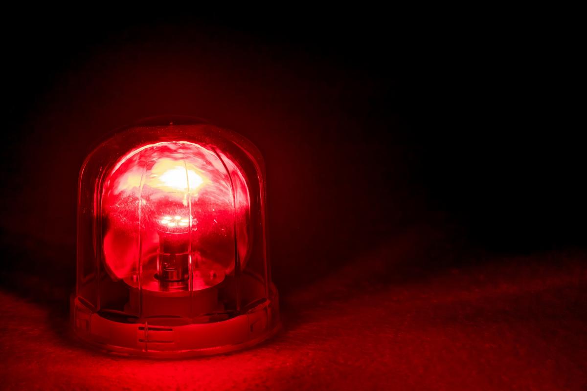 photo of a bright red light against a dark background