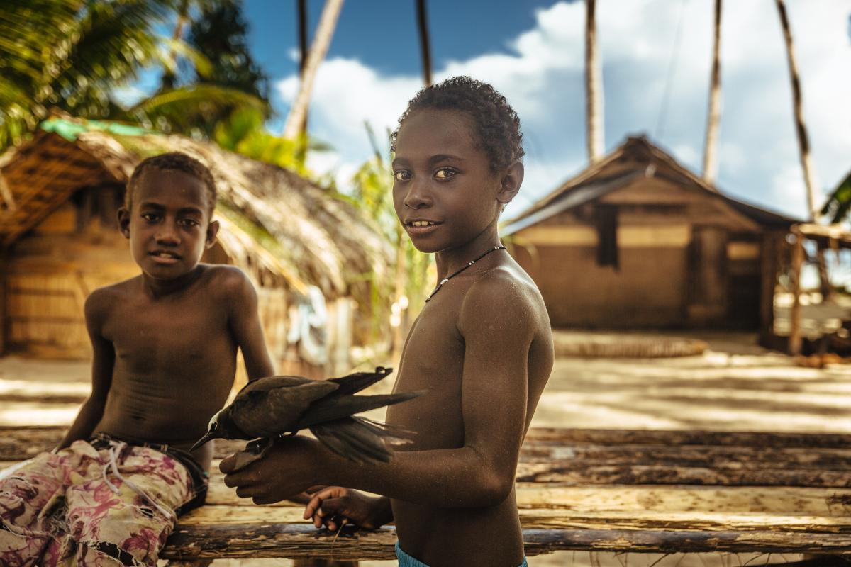 photo of two young boys outside on a Pacific Isand