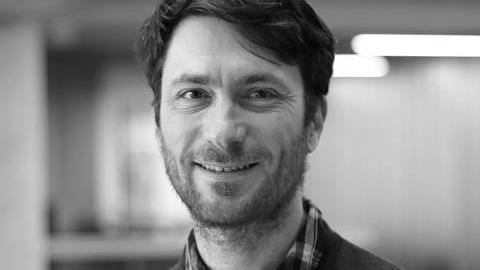 headshot of a a man - speaker David Rousell