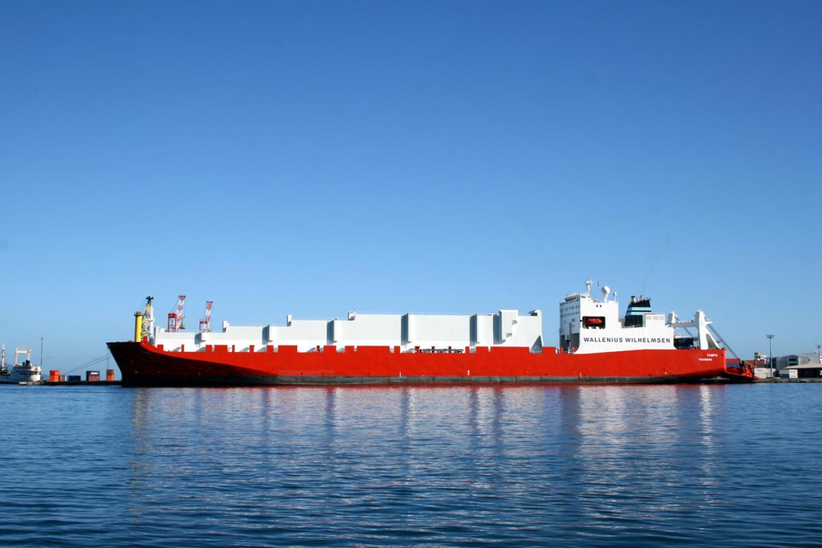 white and red ship, on blue sea with a blue sky background 