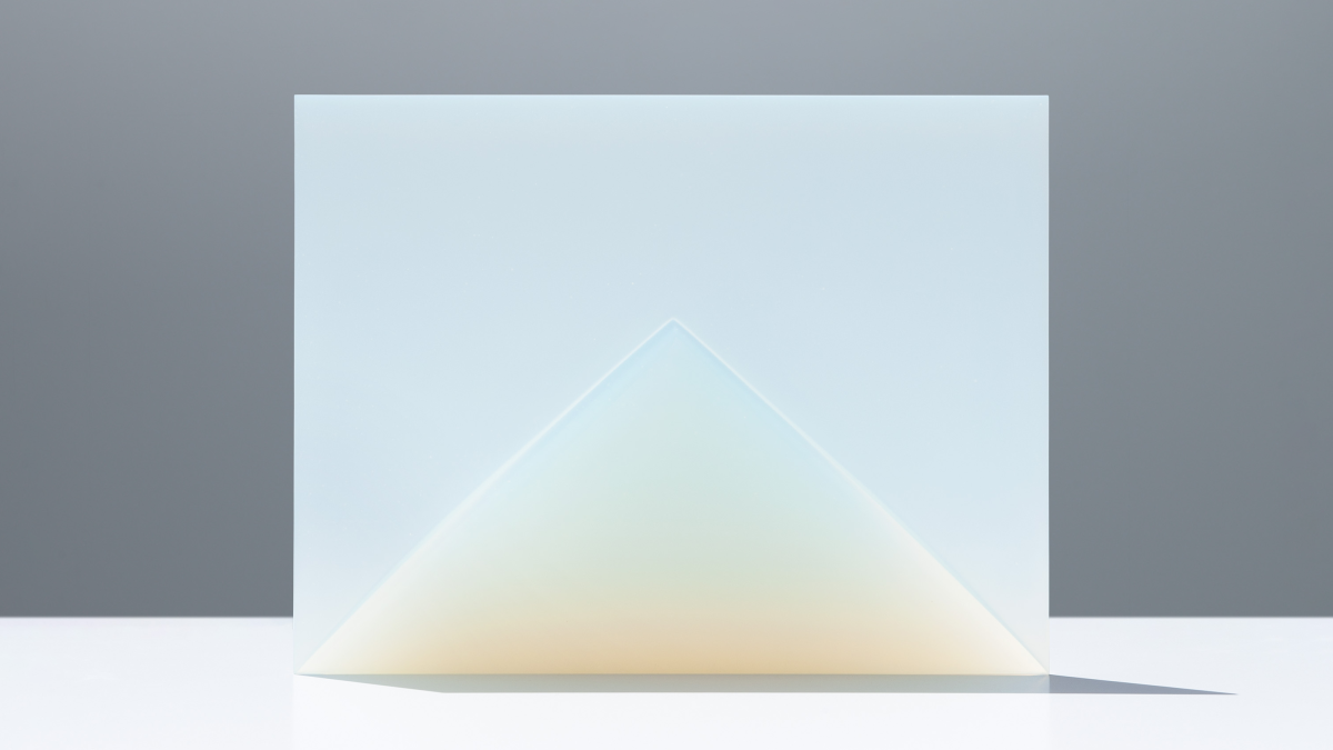 A pane of glass standing on table. 