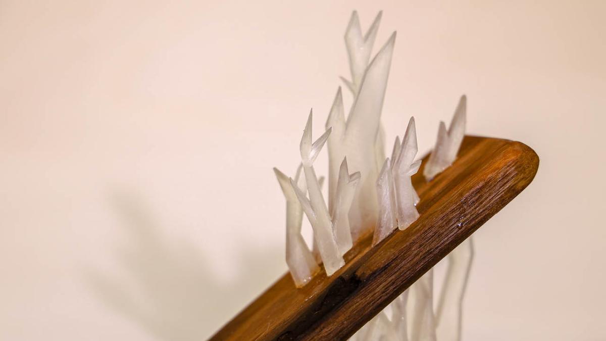 Wooden sculpture with crystal-like features