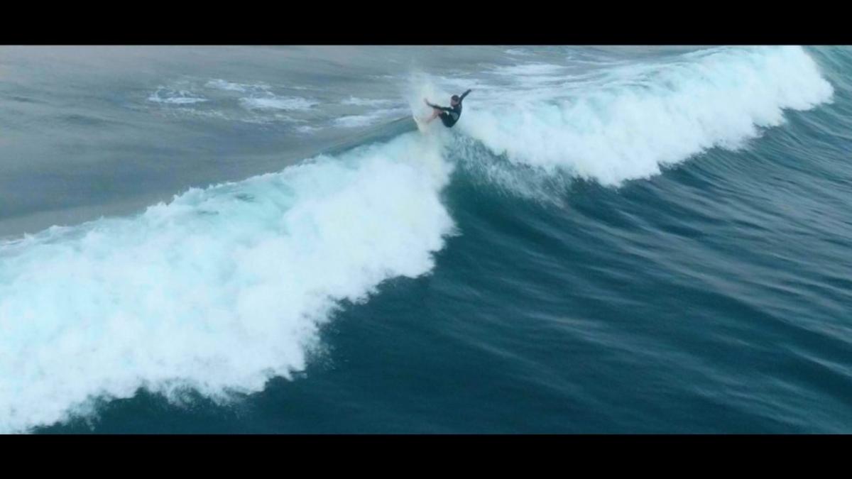 a surfer in a wave photo 