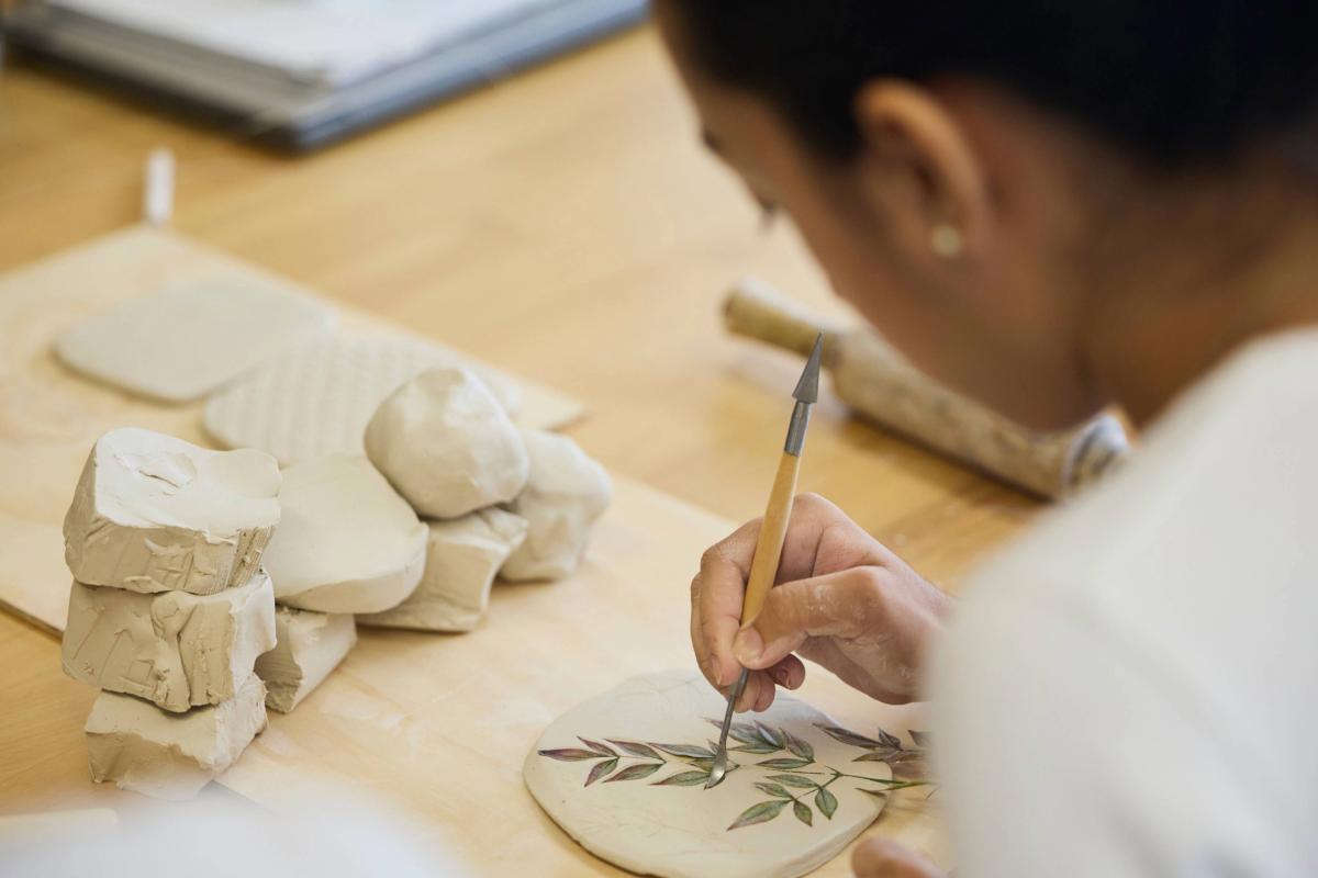 Student doing ceramic artwork