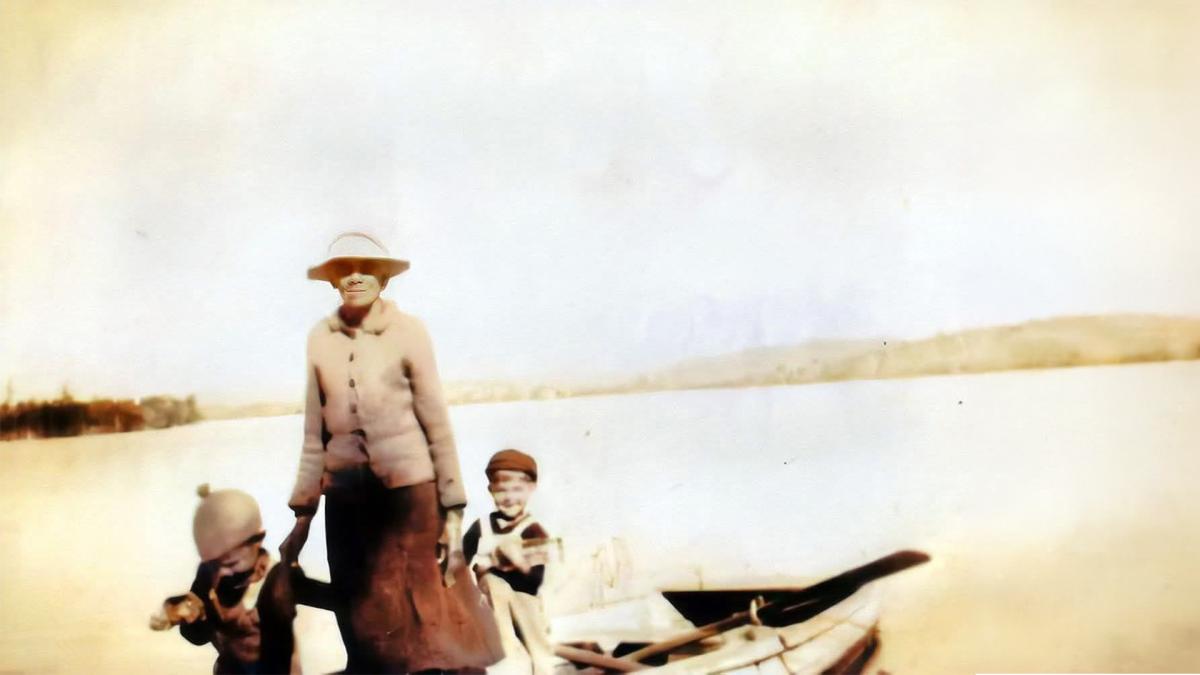 grandmoth on boat with children