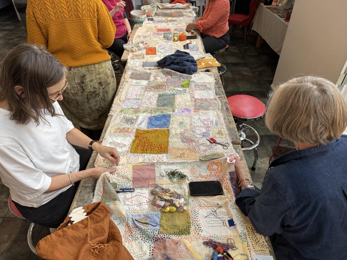 Photo of women stitching cloth