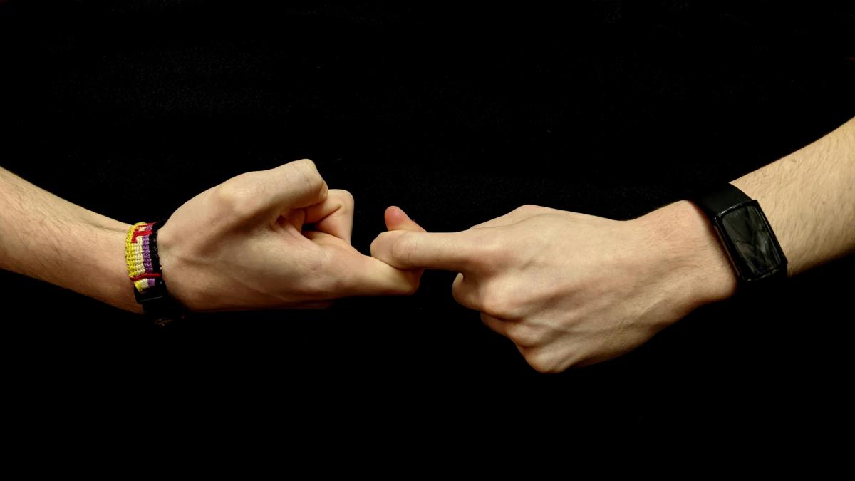 Two hands forming sign language 